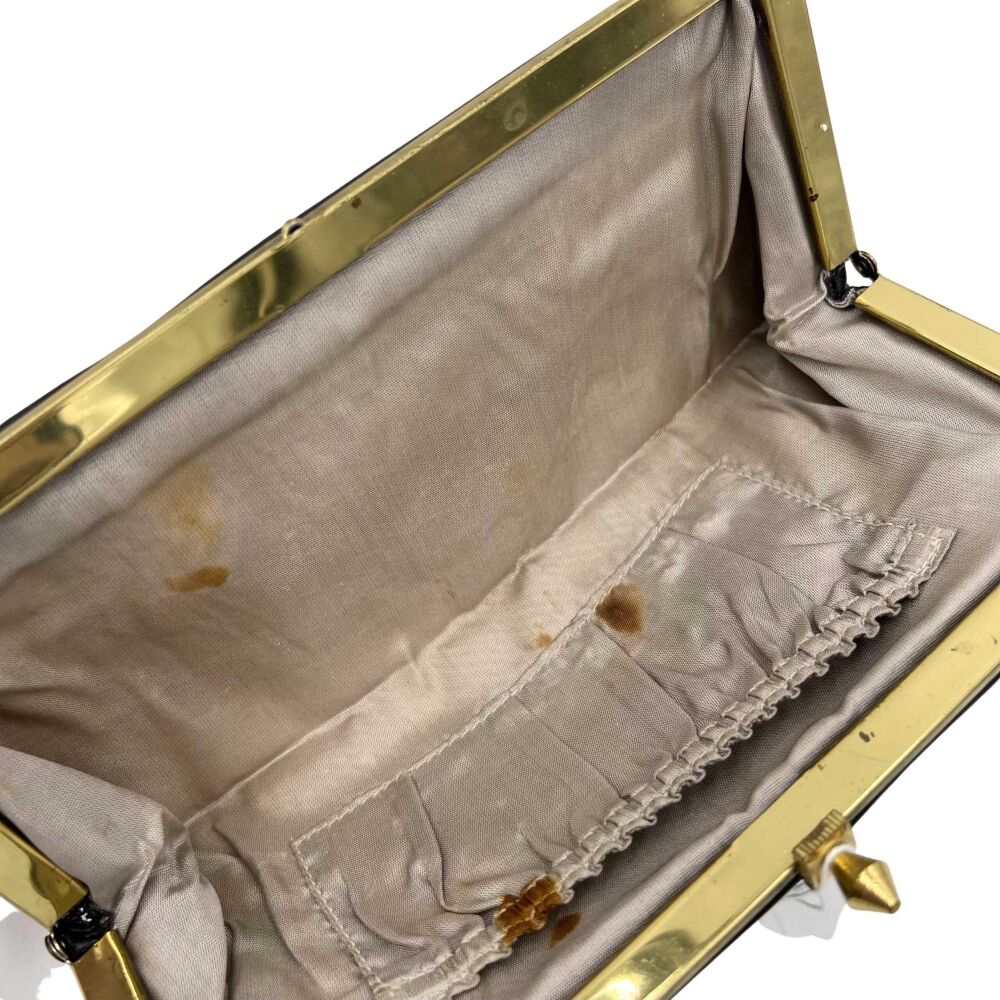 Pochette en cuir noir avec fermoir doré