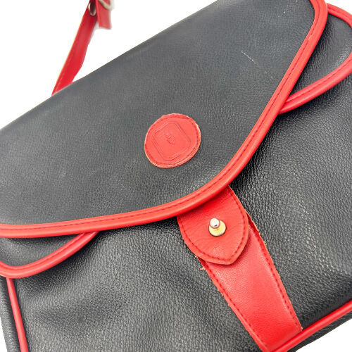 Sac à bandoulière en cuir noir avec détails rouges